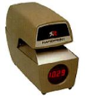 Automatic time and date stamp with round analog clock face automatically prints when paper is inserted. Prints with an adjustable stamping force for multiple-copy forms.Ribbons advance and reverse automatically, sturdy lock and brass typewheels.