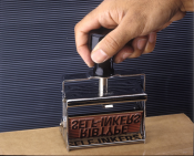 This Justrite heavy duty Self-Inker come with RIBbase on the die plate for changing messages.  It has a heavy duty frame, large plastic handle and precision components are made for heavy duty use and make excellent impressions.